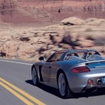 photo of a porsche carrera gt on the road