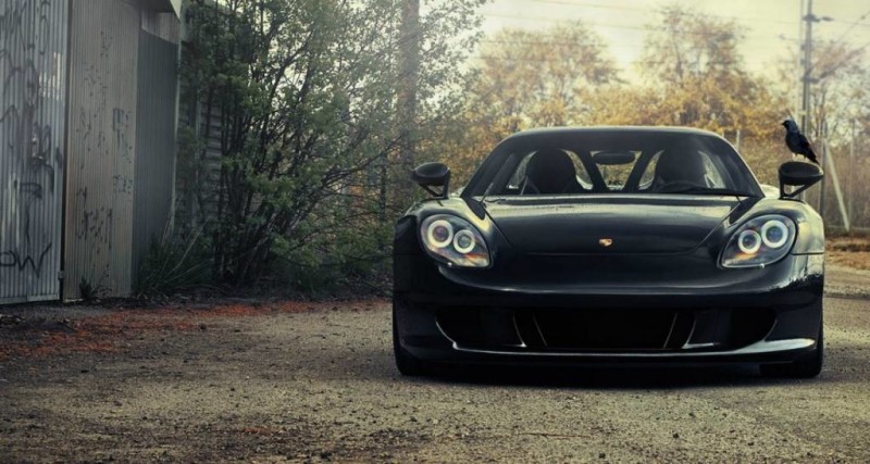 front view of black porsche carrera gt